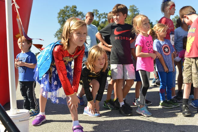 Superhero kids get ready to race before the the Warriors 4 William 2018 Kids Fun Run. This year's event is Satuday, Oct. 27, at JF Gregory Park in Richmond Hill. [Photo courtesy of Christine Hall Photography]