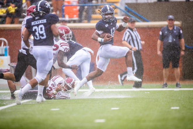 Georgia Southern's Wesley Kennedy III, a Benedictine graduate, runs past New Mexico State defenders to score the first Eagles touchdown Saturday at Paulson Stadium in Statesboro. [HUNTER CONE/SAVANNAHNOW.COM]