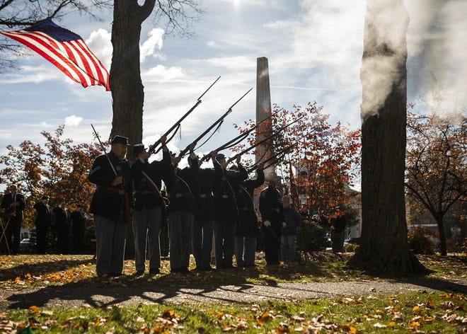 Members of the 13th Massachusetts Volunteer Infantry fire off rifles during the rededication and 150th anniversary of Shrewsbury's Civil War monument ceremony on Saturday. View a photo gallery on telegram.com. [T&G Staff/Ashley Green]