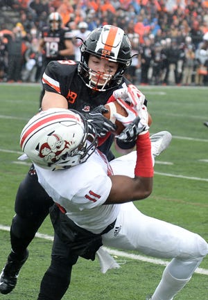 McKinley receiver Jalen Ross makes the catch against Massillon's Preston Hodges during the two teams' 2018 meeting. (CantonRep.com / Ray Stewart)
