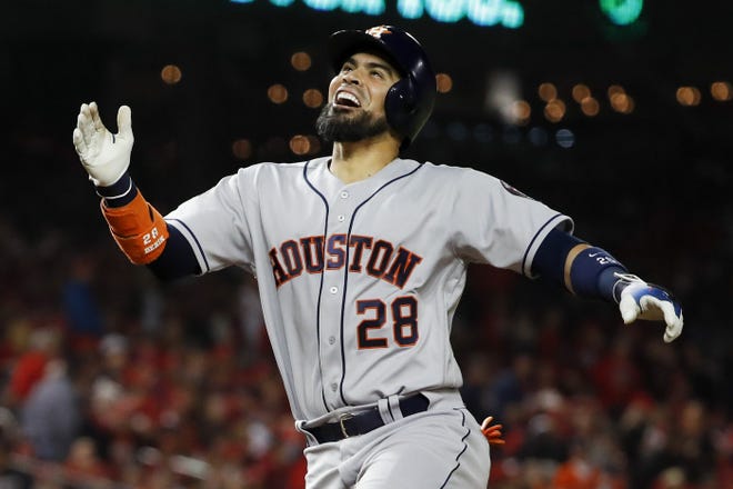 Houston's Robinson Chirinos celebrates his two-run home run during the fourth inning of Game 4 of the World Series against Washington on Saturday night. [AP / Jeff Roberson]