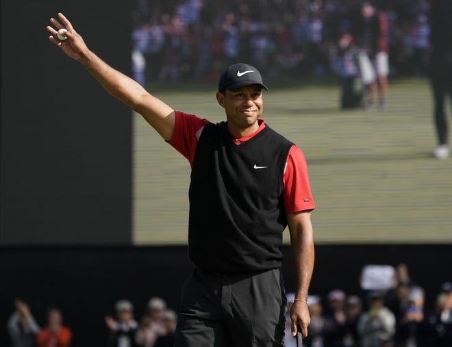 Tiger Woods of the United States celebrates after his putt during the final round of the Zozo Championship PGA Tour at the Accordia Golf Narashino country club in Inzai, east of Tokyo, Japan, Monday, Oct. 28, 2019. (AP Photo/Lee Jin-man)