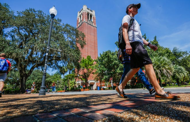 Students walk through the University of Florida campus near Century Tower in August. A recent survey of students found 30% of female undergraduate respondents say they have experienced unwanted sexual contact, a jump of nearly 10% since the last survey four years ago. [Chris Day/GateHouse Florida]