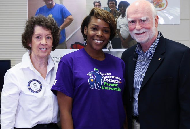 Skidaway Island Rotarians Lynn Gensamer and Tom Stanley with Parent University's Tameka Tribble, center, on Oct. 19 at the Parent University Fall Session at Johnson High School. [Provided photo]