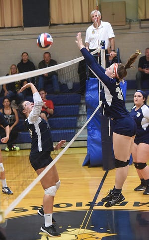 Coyle-Cassidy's Sam Hourihan, right, blocks a kill shot against a Bristol-Plymouth player last season. The Craftsmen won a 3-2 match against the Warriors on Monday.

[Taunton Gazette file photo]