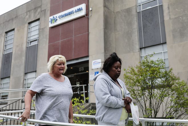 From left, clinic clients Sabrina Rains and Anita Watkins walk out of Columbus Area Integrated Health Services on Tuesday, April 30, 2019 in Columbus, Ohio. The 40-year-old mental-health and addiction treatment agency that mainly served the inner-city community, collapsed in a heap of debt and mismanagment. Now, 80 to 100 employees are suddenly furloughed, and an estimated 1,500 people have to shift their care elsewhere. The Alcohol, Drug and Mental Health Board of Franklin County (ADAMH) has taken over and will help transition patients to other careproviders. [Joshua A. Bickel/Dispatch]