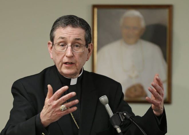 Cleveland Bishop Richard Lennon appears at a news conference in February 2013. Lennon, who retired for health reasons in December 2016, died Tuesday at age 72. [Mark Duncan/The Associated Press]