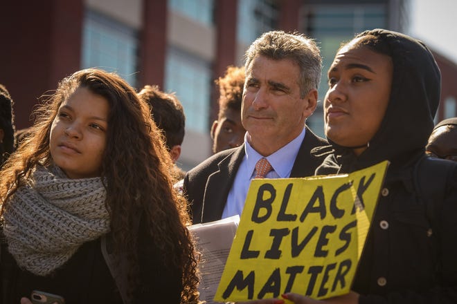 Storrs, Ct. - 10/21/2019 - UCConn president Thomas Katsouleas stands with students demonstrating at UConn on Oct. 21, 2019 in response to a recent video showing white students in the Charter Oak apartments parking using racial slurs and laughing about it as they walked past black students' apartments. (Mark Mirko/Hartford Courant/TNS)