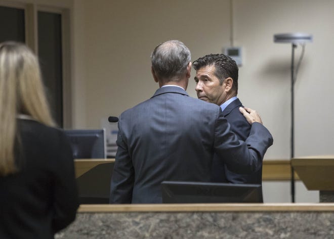 PBSO deputy Jerald Alderman, right, talks with his attorney after a hearing in a Gun Club courtroom in West Palm Beach, Florida on October 29, 2019. Alderman was charged with three counts of aggravated assault with a firearm and a charge of using a firearm while under the influence of alcohol. [GREG LOVETT/palmbeachpost.com]