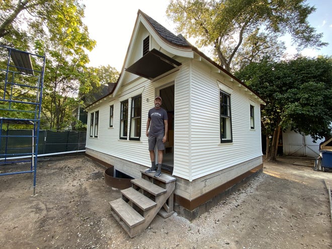 Builder Garland Turner stands in the doorway of the home at 4302 Avenue D, which is in the process of being renovated. The Calcasieu cottage has been raised to include a basement bedroom suite and powder room. [Contributed by Tyson Tuttle]