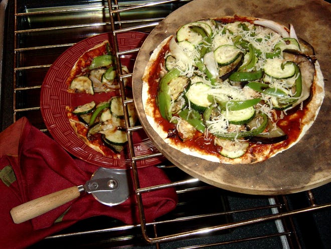 When making this Vegetable Tortilla Pizza, preheat foil-lined cookie sheet in the oven so tortillas will stay crisp.

[Linda Gassenheimer/TNS]