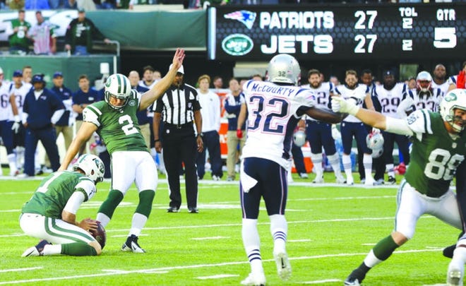 The Jets' Nick Folk kicks a field goal to beat the Patriots in overtime, 30-27, during a game in East Rutherford, N.J., on Oct. 20, 2013. On Tuesday, the Patriots signed the veteran to replace Mike Nugent. [AP, file / Seth Wenig]