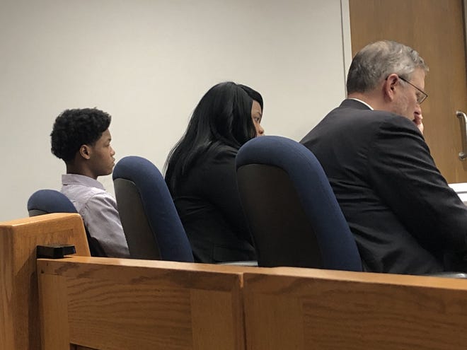 Zaveon Marks, left, and his two attorneys, Yolanda Riley and William Loeffel, listen to testimony Tuesday during the first day of his trial. The 14-year-old is accused of fatally shooting Zarious Fair, 16, on June 12 in the 700 block of East Frye Avenue in Peoria. [ANDY KRAVETZ/Journal Star]
