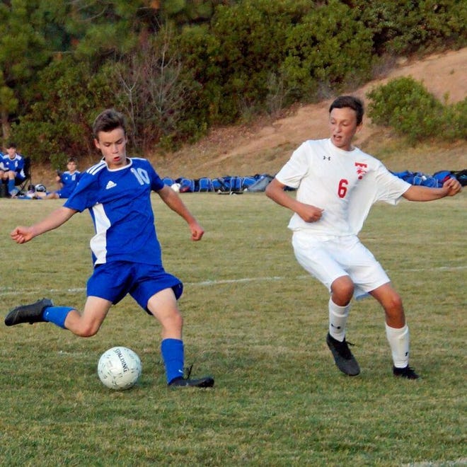 Nathaniel Bekaert of Mount Shasta, above left, scored twice against Trinity at home Thursday to finish with a team leading 13 regular season goals.
                                                                                               Photo by Dave Sjostedt