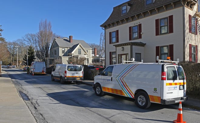 National Grid crews work their way down Catherine Street in Newport on Jan. 23, shutting off gas to homes so the supply could be safely restored eventually. [The Providence Journal, file / Steve Szydlowski]