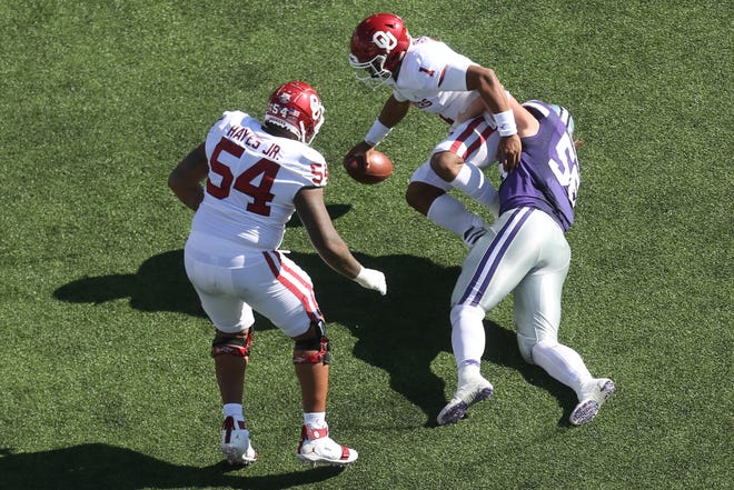 Kansas State defensive end Wyatt Hubert, a Shawnee Heights product, sacks Oklahoma quarterback Jalen Hurts in last Saturday's 48-41 Wildcat victory over the Sooners. [Evert Nelson/The Capital-Journal]