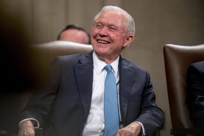 FILE - In this May 9, 2019, file photo, former Attorney General Jeff Sessions smiles during a farewell ceremony for Deputy Attorney General Rod Rosenstein in the Great Hall at the Department of Justice in Washington. Sessions is exploring the possibility of a run for his former Senate seat in Alabama. Two people with knowledge of Sessions' thinking say he has made telephone calls exploring the possibility of running for old Senate seat. (AP Photo/Andrew Harnik, File)