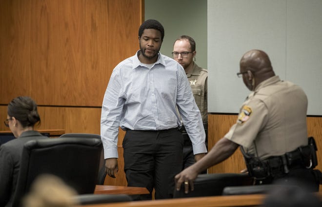 Pontrey Jones enters the courtroom for his murder trial at the Blackwell-Thurman Criminal Justice Center on Tuesday. He was found guilty of killing his stepmother and sentenced to life in prison. [JAY JANNER/AMERICAN-STATESMAN]