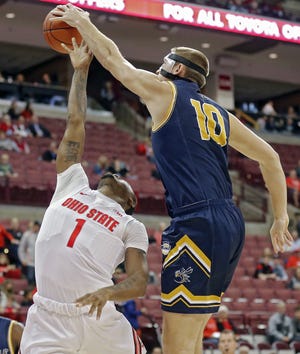 Cedarville center Kollin Van Horn (10) blocks the shot of Ohio State Buckeyes guard Luther Muhammad (1) during the 1st half of their game at Value City Arena in Columbus, Ohio on October 30, 2019. [Kyle Robertson]