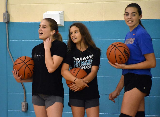 The Destin Marlins have been in the gym this week getting ready for the upcoming season. Pictured (from left) are Jessica Pierce, MJ Toth and Ava Smith. Destin plays Davidson on Monday at 5 p.m. [TINA HARBUCK/THE LOG]