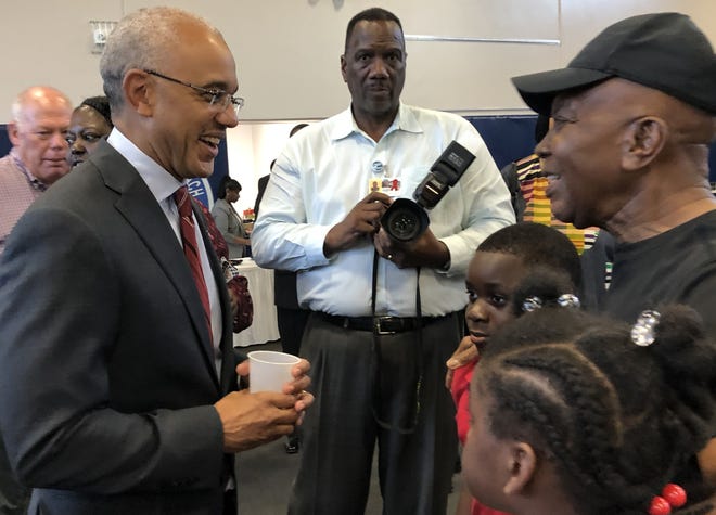 Bethune-Cookman University President Brent Chrite is greeted by attendees of a welcoming event hosted by the city of Daytona Beach on Wednesday at the Midtown Cultural & Educational Center. [News-Journal/Mark Harper]