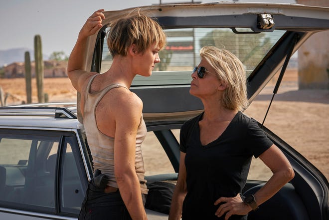 This image released by Paramount Pictures shows Mackenzie Davis, left, and Linda Hamilton in "Terminator: Dark Fate." (Kerry Brown/Paramount Pictures via AP)