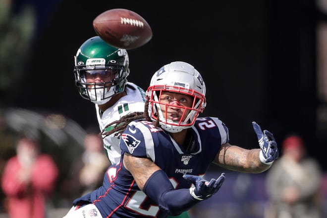 New England Patriots cornerback Stephon Gilmore moves to catch a pass intended for New York Jets wide receiver Robby Anderson (11) during an NFL football game, Sunday, Sept. 22, 2019, in Foxborough, Mass. The pass fell incomplete.