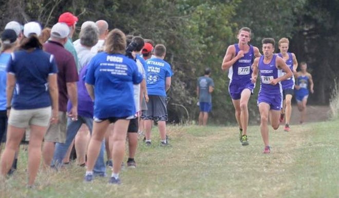 Southeast of Saline's Dylan Sprecker, left, follows teammate Luke Gleason, middle, with Dominic Jackson close behind during the Southeast of Saline Invitational in September. Southeast will defend its state Class 3A team title Saturday in Lawrence. [JOURNAL FILE PHOTO]