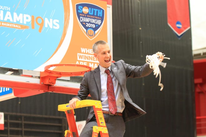 Gardner-Webb men’s basketball coach Tim Craft celebrates after the Runnin’ Bulldogs claimed the 2019 Big South title. [Big South Conference photo]
