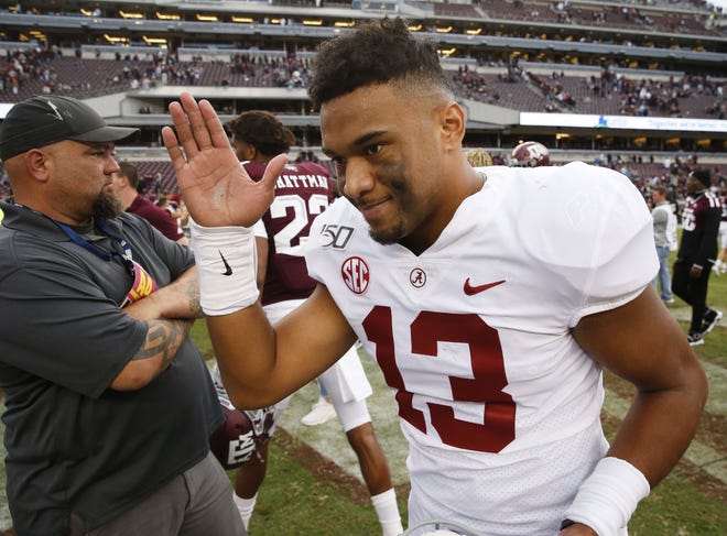 Alabama quarterback Tua Tagovailoa (13) greets other players following Alabama's 47-28 victory at Kyle Field Saturday, Oct. 12, 2019 in College Station, Texas. [Staff Photo/Gary Cosby Jr.]