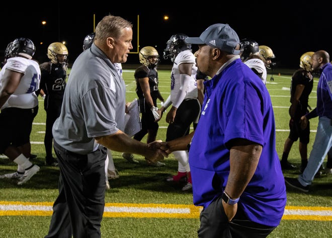 LBJ coach Jahmal Fenner, right, shaking hands with Crockett coach John Waugh after a game this season, said his school’s separation from LASA for athletic purposes will benefit students from both schools. [JOHN GUTIERREZ/FOR STATESMAN]