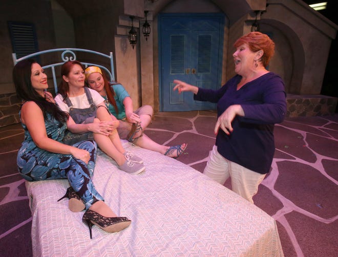 Katrina Ploof, right, works with Michelle Geering, Gina England and Danielle Posner, left to right, during a rehearsal of "Mamma Mia" at the Ocala Civic Theatre in 2018. Ploof, who took over as interim executive director of the theater after the death of Mary Britt, was recently named the theater’s artistic director. [Ocala Star-Banner File]