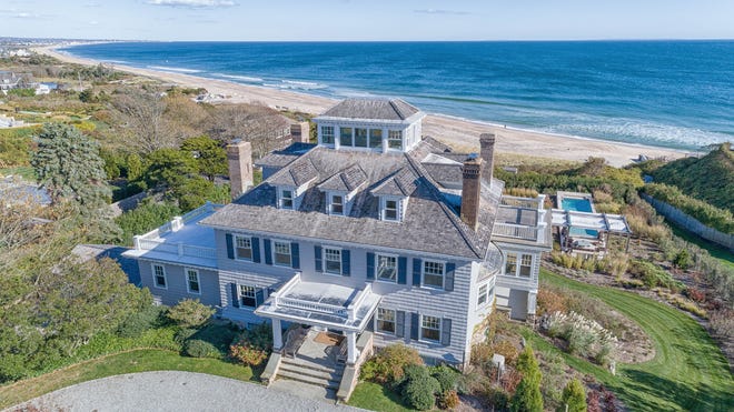 The circa-1903 three-story house at 10 Bluff Avenue has nine bedrooms and eight-and-a-half bathrooms and sits on 160 feet of beach frontage overlooking the Atlantic Ocean. [Mott & Chace Sotheby’s International Realty photo]