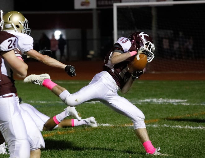 Killingly's Cooper Morissette comes up with an interception during the Red Hawks' win against Stonington on Friday night. (Tammy McManaway/For The Bulletin)