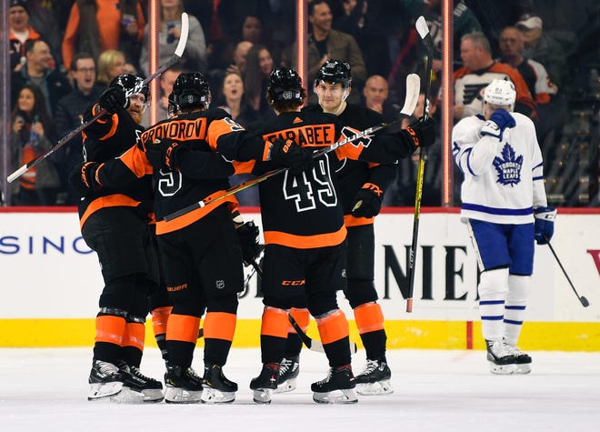 The Flyers' Ivan Provorov (9) celebrates with teammates, from left, Jake Voracek, Joel Farabee and James van Riemsdyk after scoring a goal in the first period against the Maple Leafs. [DERIK HAMILTON / ASSOCIATED PRESS]