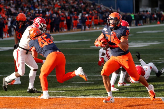 Illinois running back Dre Brown rushes for a touchdown during the second half of an NCAA college football game against Rutgers, Saturday, Nov. 2, 2019, in Champaign, Ill. (AP Photo/Charles Rex Arbogast)
