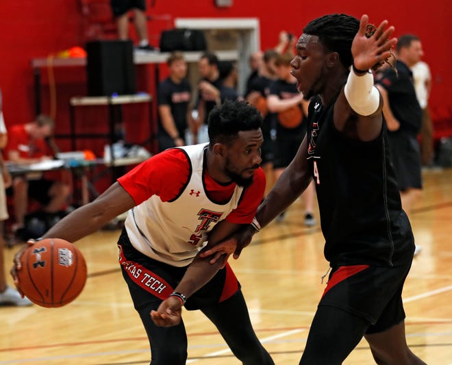 Texas Tech's Joel Ntambwe (5) drives the ball around Chris Clarke (44) during a Sept. 24 practice in the auxiliary gym inside United Supermarkets Arena. Ntambwe, a UNLV transfer, is waiting word on a waiver for immediate eligibility. [Brad Tollefson/A-J Media]