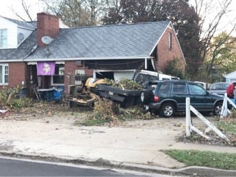 This house and attached garage, at 2724 Harmont Ave. NE, in Canton, was damaged during a traffic accident on the road Saturday morning. (Reader submitted photo).