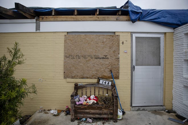 Stuffed animals sit outside a boarded up housing development damaged from Hurricane Michael in Panama City, Fla, Thursday, Jan. 24, 2019. Of all areas on the Florida Panhandle affected by Michael, Bay County with 183,000 residents was the hardest hit: Officials said almost three-quarters of its 68,000 households were impacted in some way. [ DAVID GOLDMAN / AP ]
