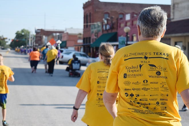 Participants walk for Alzheimer’s in Smithville. U.S. Rep. Roger Williams, R-Texas, is co-sponsoring a bill to help people younger than 60 who have the disease. [SMITHVILLE TIMES 2017 FILE]