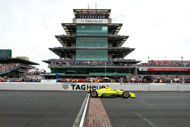 FILE - In this May 26, 2019, file photo, Simon Pagenaud, of France, crosses the start/finish line on the start of the Indianapolis 500 IndyCar auto race at Indianapolis Motor Speedway, in Indianapolis. Indianapolis Motor Speedway and the IndyCar Series have been sold to Penske Entertainment Corp. in a stunning announcement that relinquishes control of the iconic speedway from the Hulman family after 74 years. (AP Photo/Rob Baker, File)