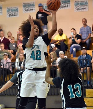 Destin's Asa Newell goes up for a shot against the Davidson Panthers. Newell led Destin with 25 points in their 55-29 victory. [TINA HARBUCK/THE LOG]