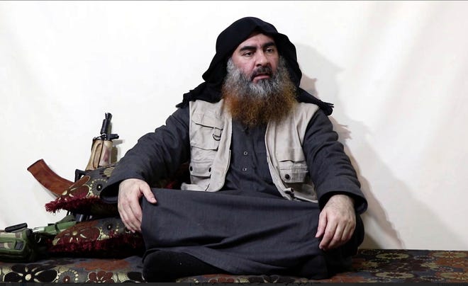 FILE - This file image made from video posted on a militant website April 29, 2019, purports to show the leader of the Islamic State group, Abu Bakr al-Baghdadi being interviewed by his group's Al-Furqan media outlet. In his last months on the run, al-Baghdadi was agitated, fearful of traitors, sometimes disguised as a shepherd, sometimes hiding underground, always dependent on a shrinking circle of confidants. (Al-Furqan media via AP, File)