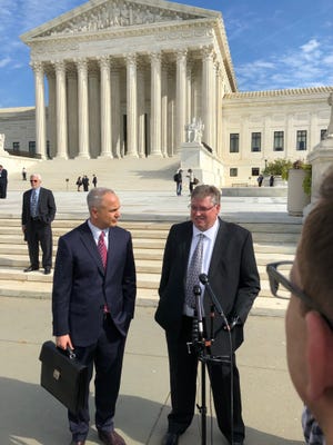 Lawyer Derek Shaffer, left, and underwater videographer Rick Allen of Fayetteville speak outside the U.S. Supreme Court on Tuesday. The court heard Allen’s lawsuit against the state of North Carolina that alleges the state violated his copyright to videos and a photo he made of the archaeological work of Blackbeard’s pirate ship. [Johnny Horne/Contributed]
