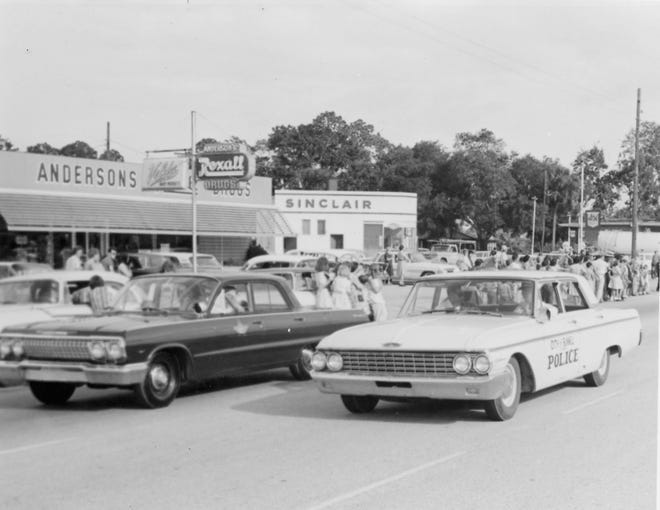 Police cars lead a Veterans Day parade in Bunnell on Nov. 11, 1963. [Flagler County Historical Society]