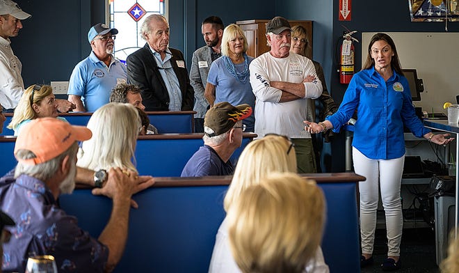 Florida Agriculture Commissioner Nikki Fried talks to a group gathered at The Commander’s Shellfish Camp restaurant in Crescent Beach on Wednesday. [PETER WILLOTT/THE RECORD]