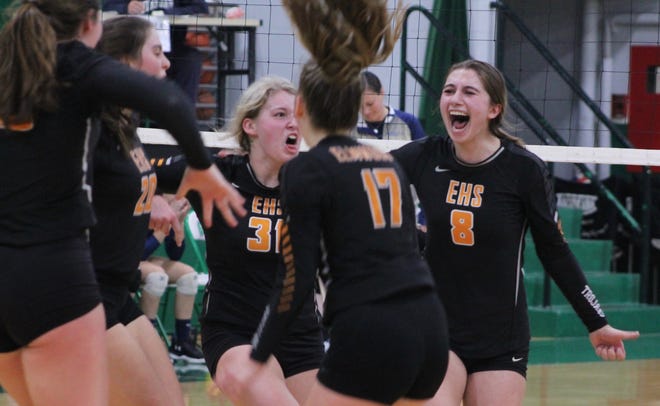 Taylor Herman (31) and Isabella Guppy (8) lead Elmwood's celebration of match point on Monday night in the Class 1A sectional semifinals. [Troy E. Taylor]