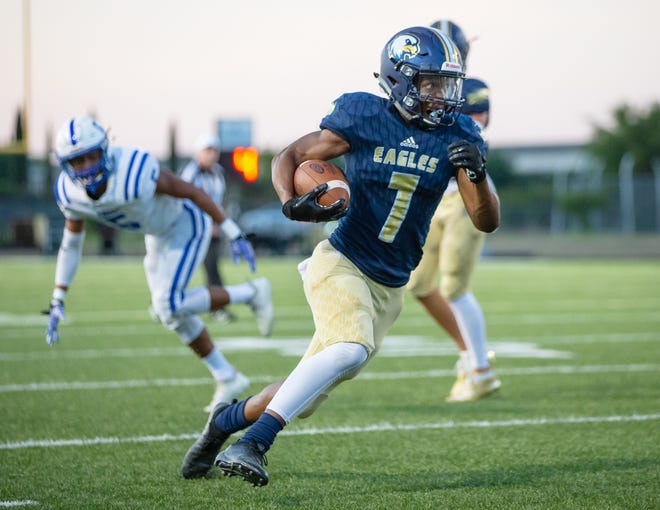 Akins running back Nathan Davis (see here in earlier action this year) paced the Eagle offense with 242 rushing yards and four touchdowns in their 40-28 win over Lehman Thursday. [JOHN GUTIERREZ/FOR STATESMAN]
