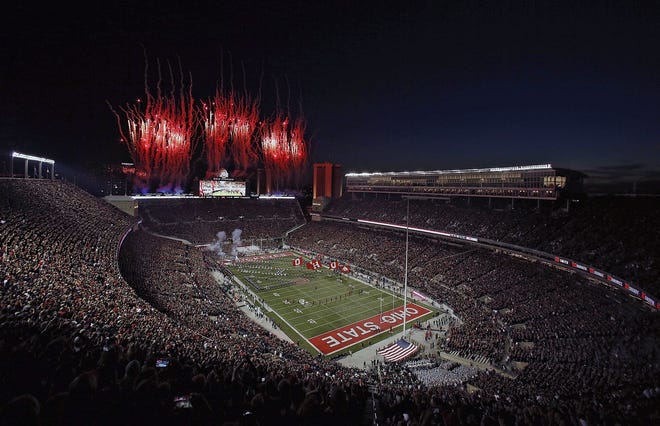 Ohio State Buckeyes take to the field as fireworks go off at Ohio Stadium before the game against Michigan State Spartans in Columbus, Ohio on October 5, 2019. [Kyle Robertson/Dispatch]