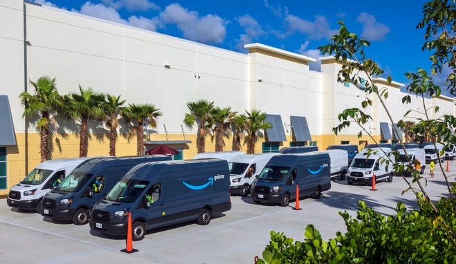 Amazon trucks line up to load up the day's deliveries at a new distribution facility on Belvedere Road in suburban West Palm Beach Thursday, November 7, 2019. [LANNIS WATERS/palmbeachpost.com]